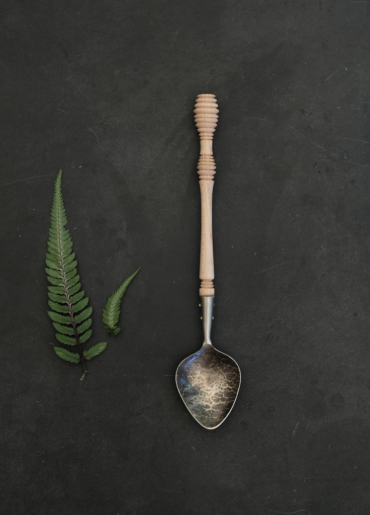 Bee hive turned spoon