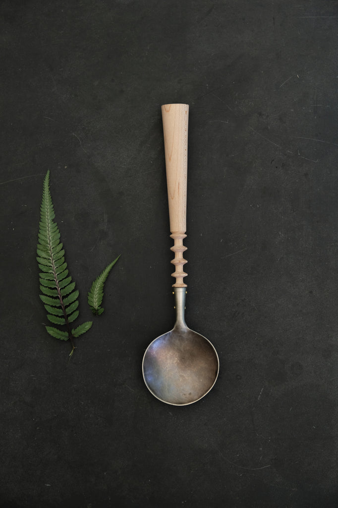 Stacked saucers turned spoon