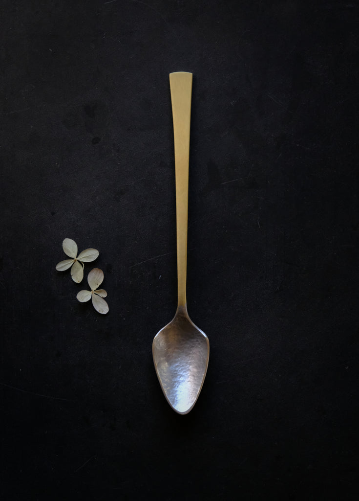 unique handmade spoon of brass and tin